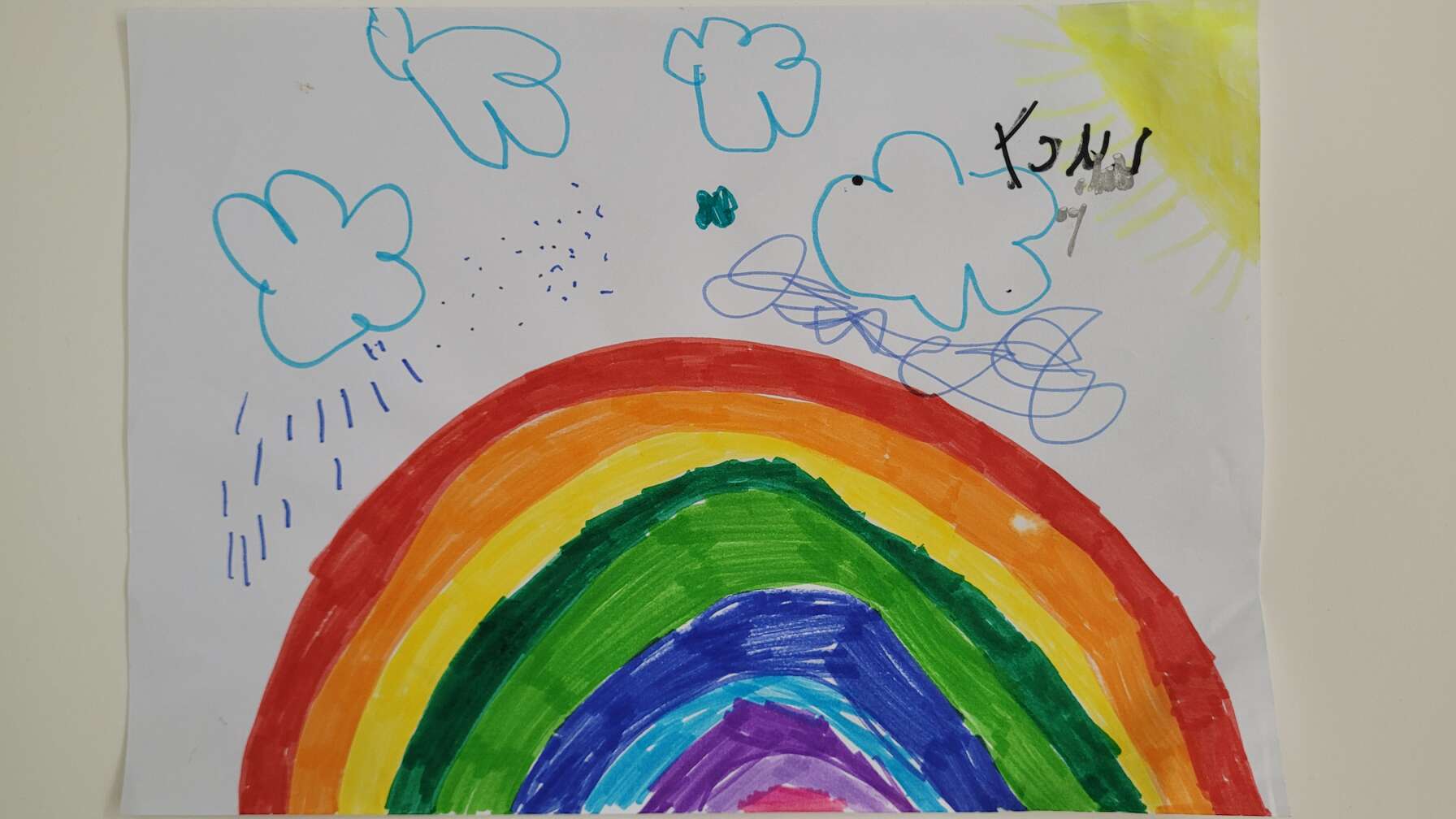Ein Kinderbild von einem Regenbogen