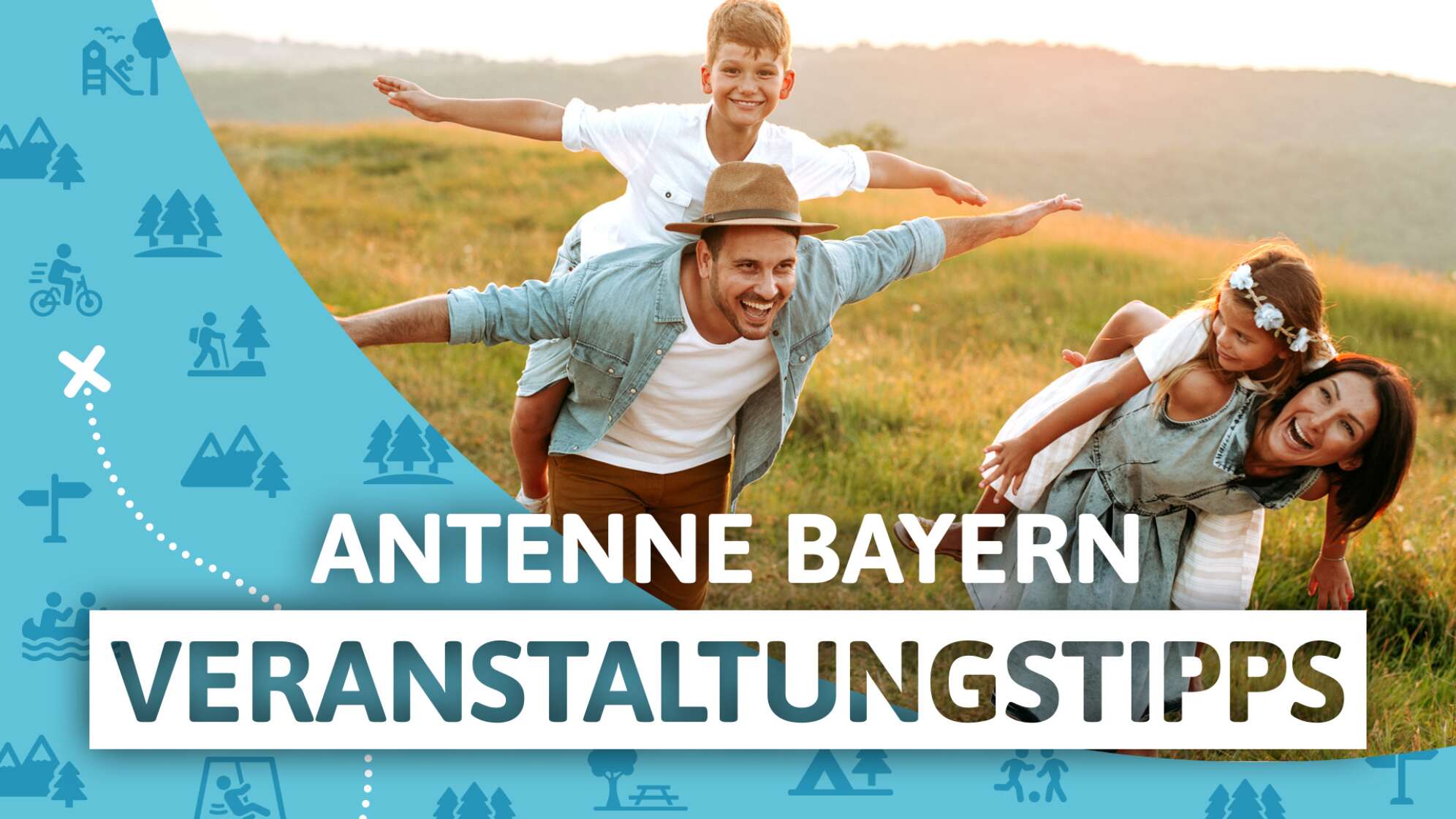 Lachende Familie auf Wiese