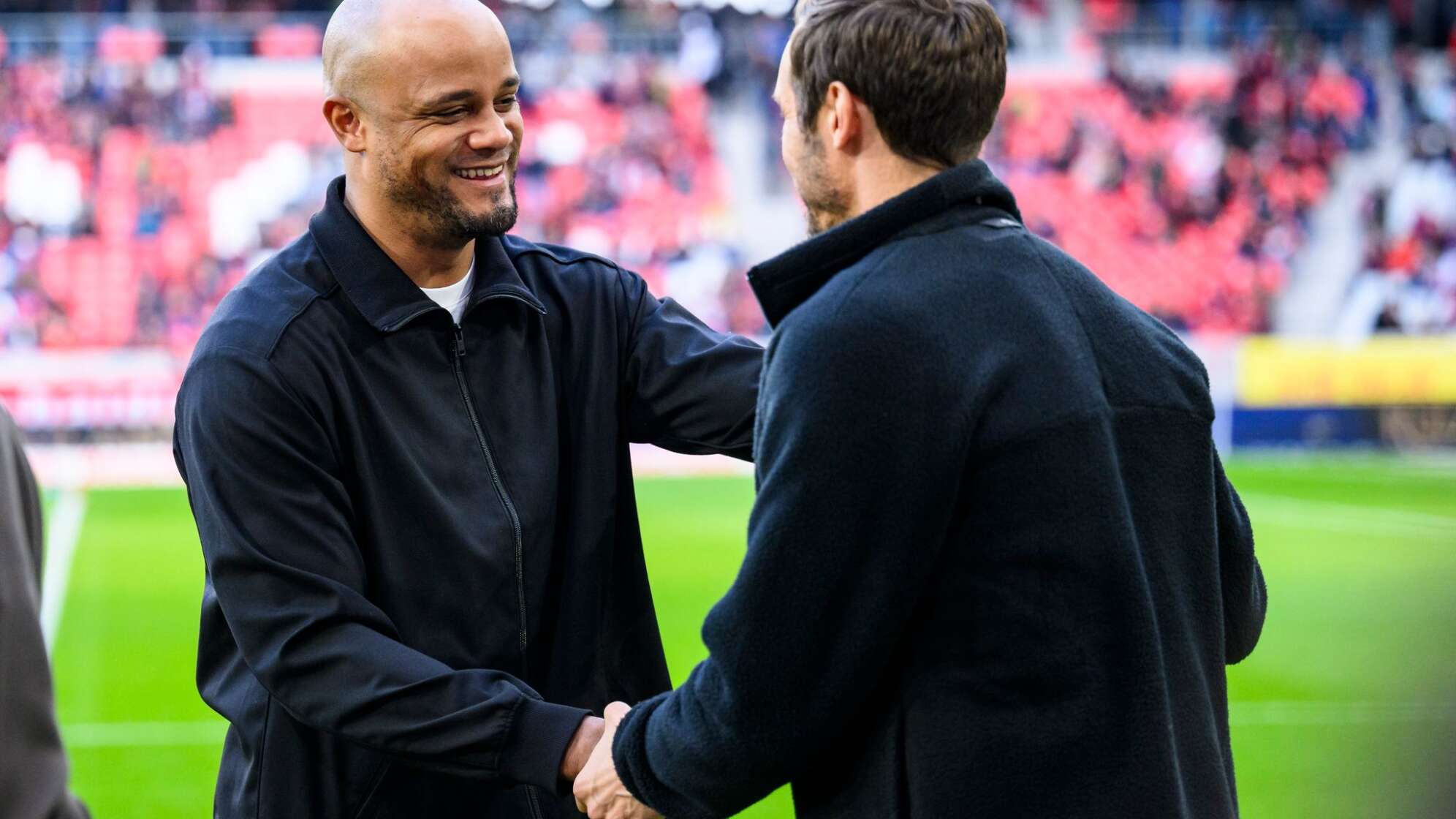 Vincent Kompany (l) und Julian Schuster (r)